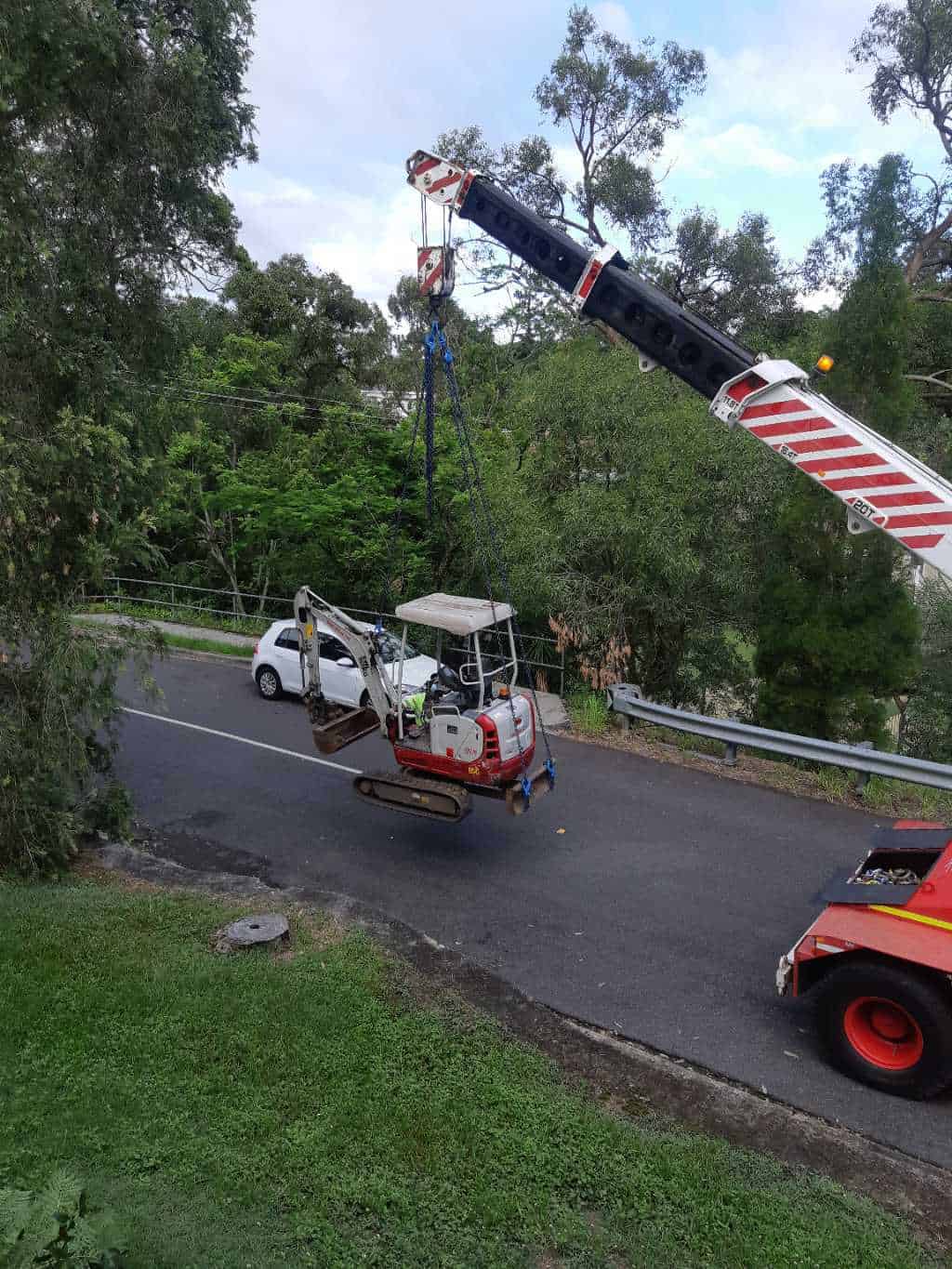 Moving excavator with crane