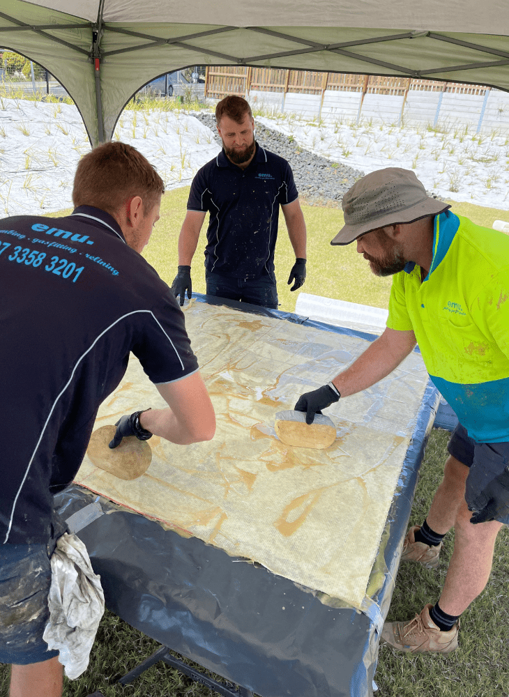 Stormwater Pipe Rehabilitation Redbank plains. Emu team preparing resin on relining