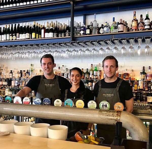 Mrs Brown's Bar and Kitchen staff standing behind the bar